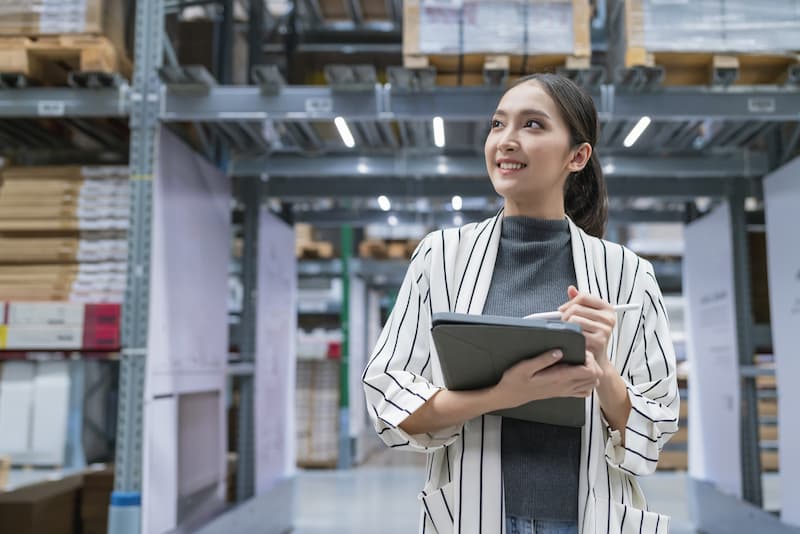 Lady taking inventory of warehouse