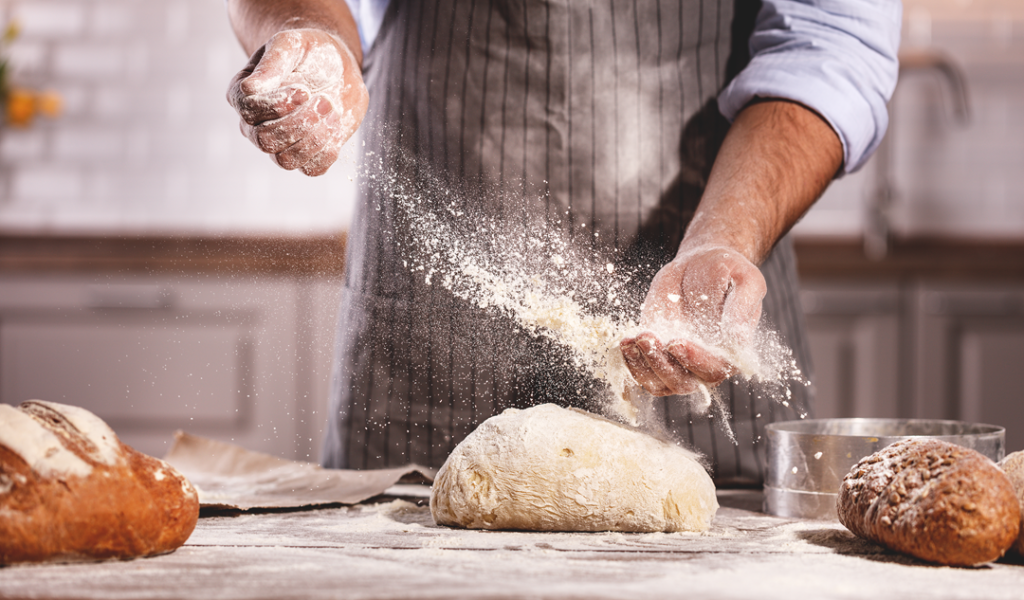 a guy baking some bread