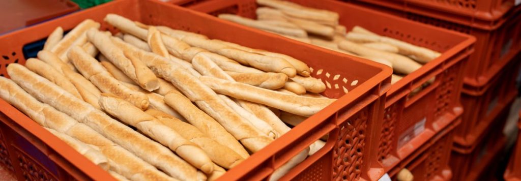 freshly baked bread in plastic storage boxes